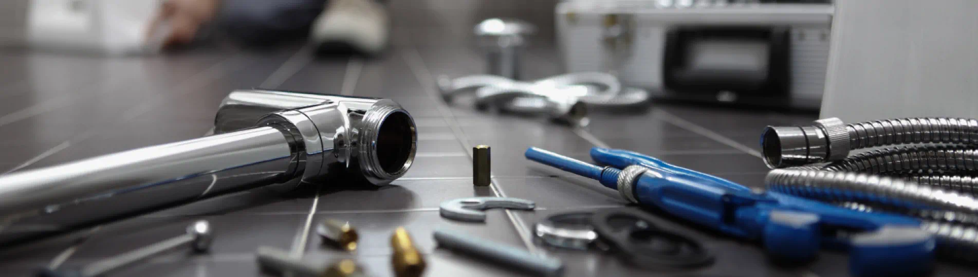 plumbing tools scattered on the floor